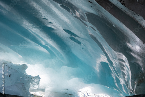 Ice cave in the glacier of Langgletscher at Lötschental in Wallis, Switzerland photo