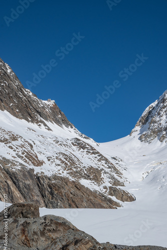 View of the Lötschental valley and glacier in autumn with snow covered peaks in Valais, Switzerland photo