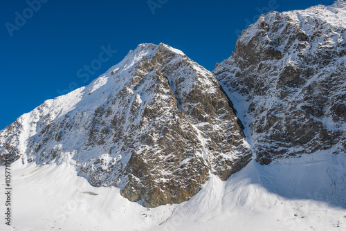 View of the Lötschental valley and glacier in autumn with snow covered peaks in Valais, Switzerland photo