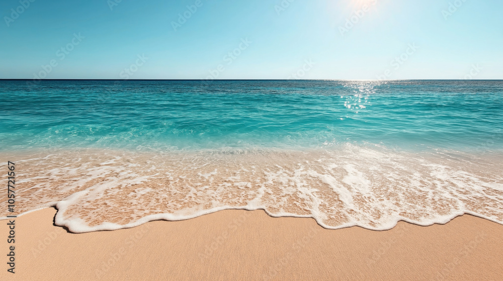 Tranquil sandy beach with gentle ocean waves under a clear blue sky and sunlight reflecting on the water surface. Tranquil sandy beach with gentle ocean waves under a clear blue sky and sunlight reflecting on the water surface.