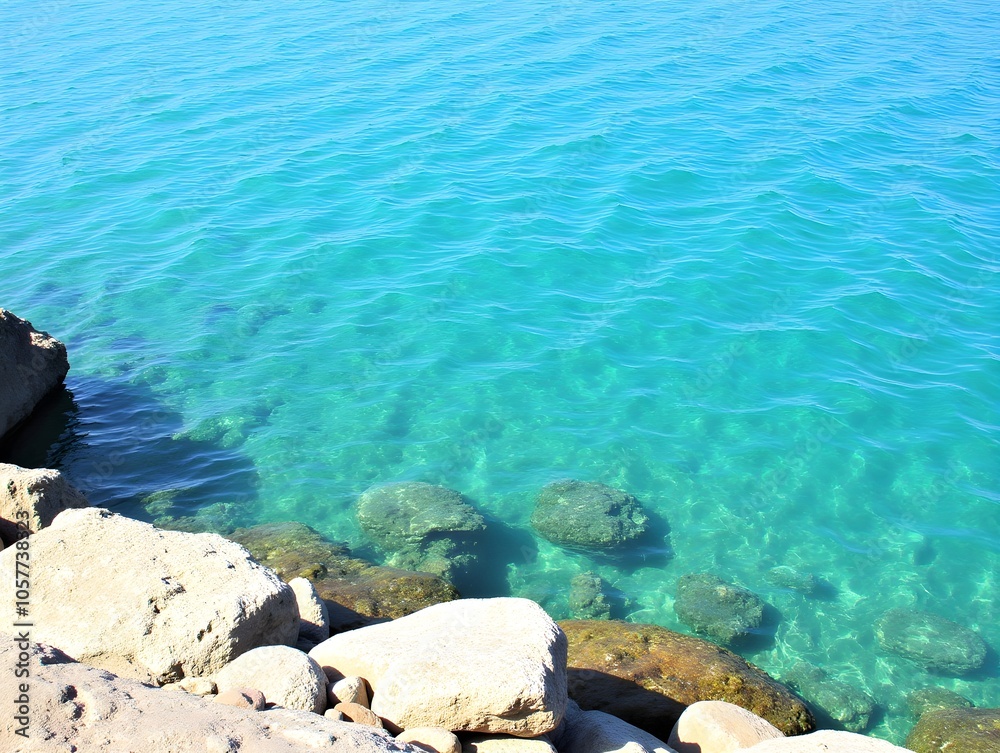 Crystal clear sea on rocky shore Crystal clear sea on rocky shore