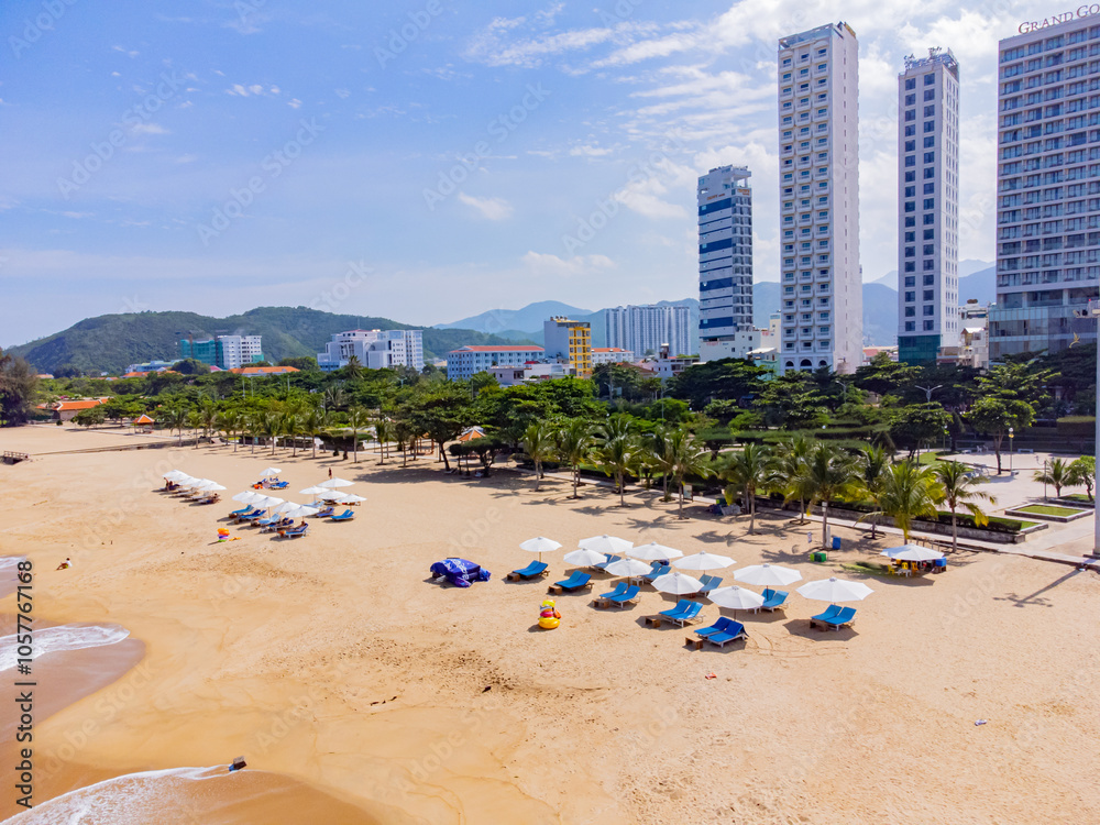 City beach. Nha Trang is a resort city in Vietnam. It's a sunny day. Shooting from a drone. City beach. Nha Trang is a resort city in Vietnam. It's a sunny day. Shooting from a drone.