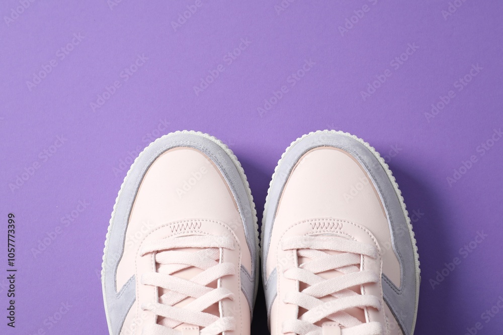 Pair of stylish sneakers on a colored background Pair of stylish sneakers on a colored background