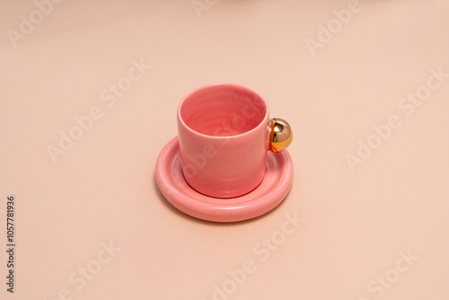 pink porcelain, with a gold handle