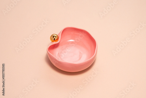 pink porcelain, with a gold handle