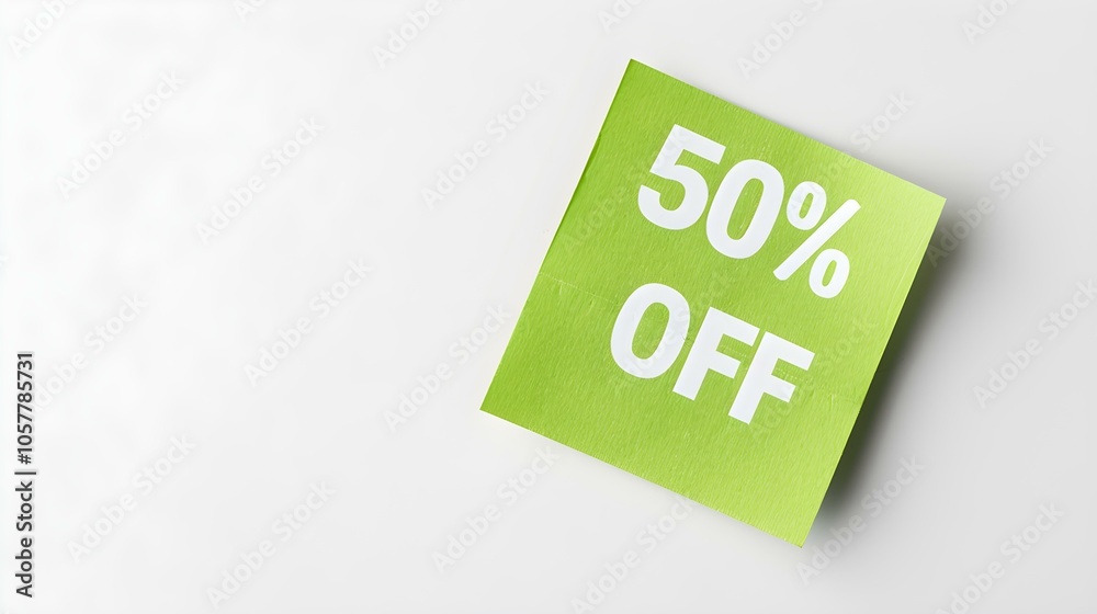 White '50% OFF' Text on a Green Square Paper Note. White Background with Copy Space White '50% OFF' Text on a Green Square Paper Note. White Background with Copy Space