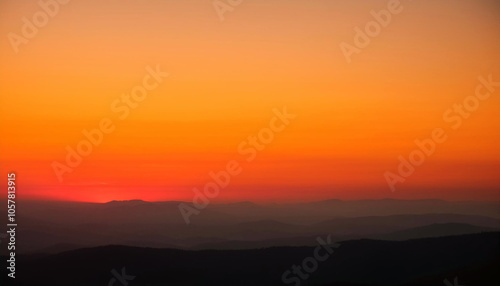 Fiery sunset paints the distant mountains. Breathtaking!