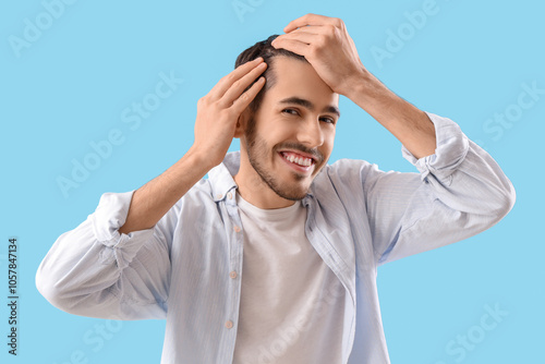 Smiling young brunette man ...