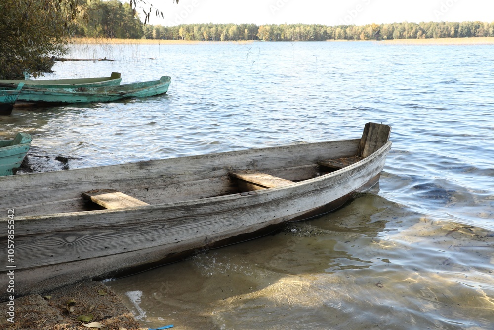 Obraz premium Many wooden boats on river. Water transportation