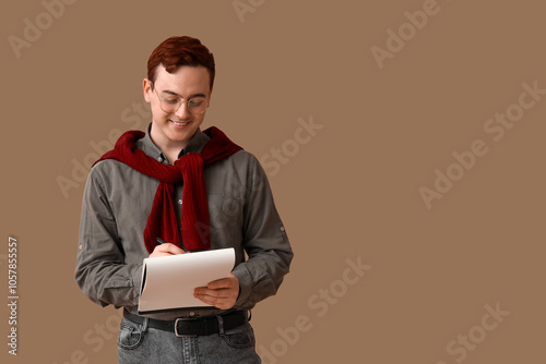 Young writer with notebook ...