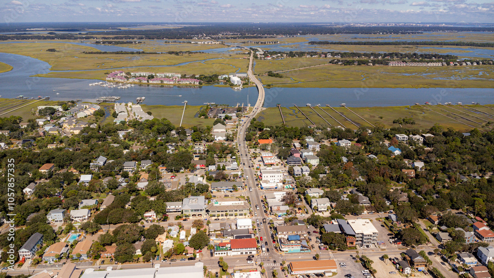 Fototapeta premium Aerial view of coastal beach town with rivers and Charleston in background