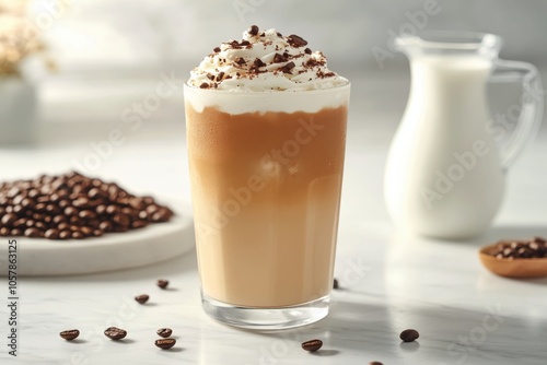 Delicious iced coffee topped with whipped cream and chocolate shavings on a m...