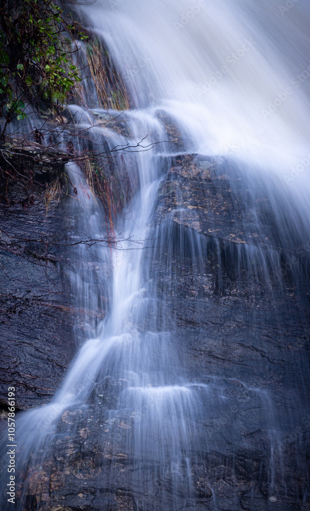 Small falls and tiny water trails next to Looking Glass Falls Small falls and tiny water trails next to Looking Glass Falls