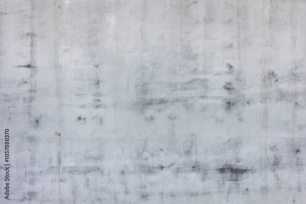 Textured gray concrete wall with subtle shadows creating abstract background, versatile composition concept