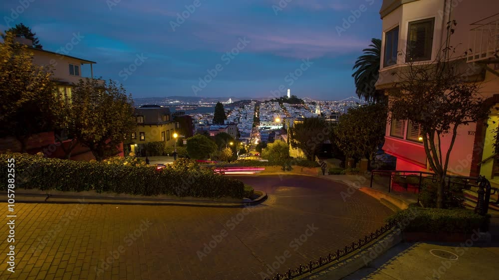 SAN-FRANCISCO , USA - OCTOBER 26, 2024: Evening view of Lombard Street with vibrant flowers and city skyline in the background SAN-FRANCISCO , USA - OCTOBER 26, 2024: Evening view of Lombard Street with vibrant flowers and city skyline in the background