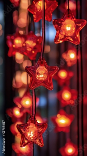 Bright red star shaped lights illuminating a cozy indoor space during the eve...