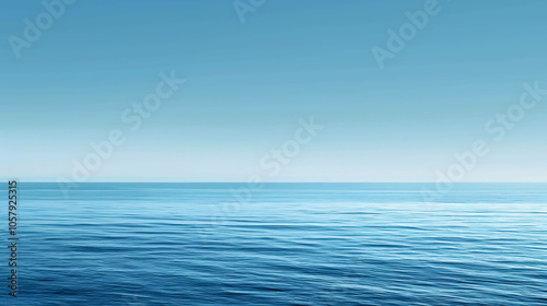 Deep blue ocean with a clear blue sky. The water is calm and still, with small waves rippling on the surface.