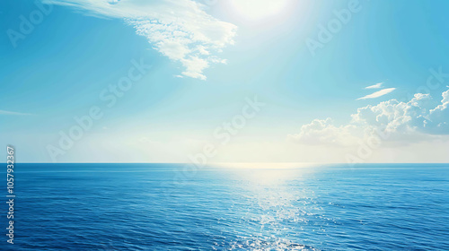 The deep blue sea stretches out to the horizon, meeting the bright blue sky above.