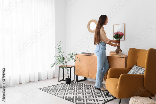 Young woman with protea flo...