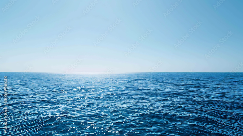 Obraz premium The deep blue sea stretches out before you, endless and mysterious. The only sound is the gentle lapping of the waves against the shore.