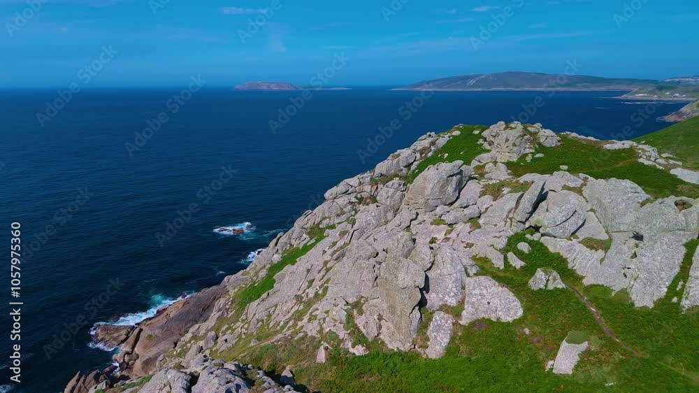 Rock formations at the Punta Nariga Lighthouse located at Punta Nariga, near Malpica de Bergantiños in the province of La Coruña. Galicia. Spain. Europe