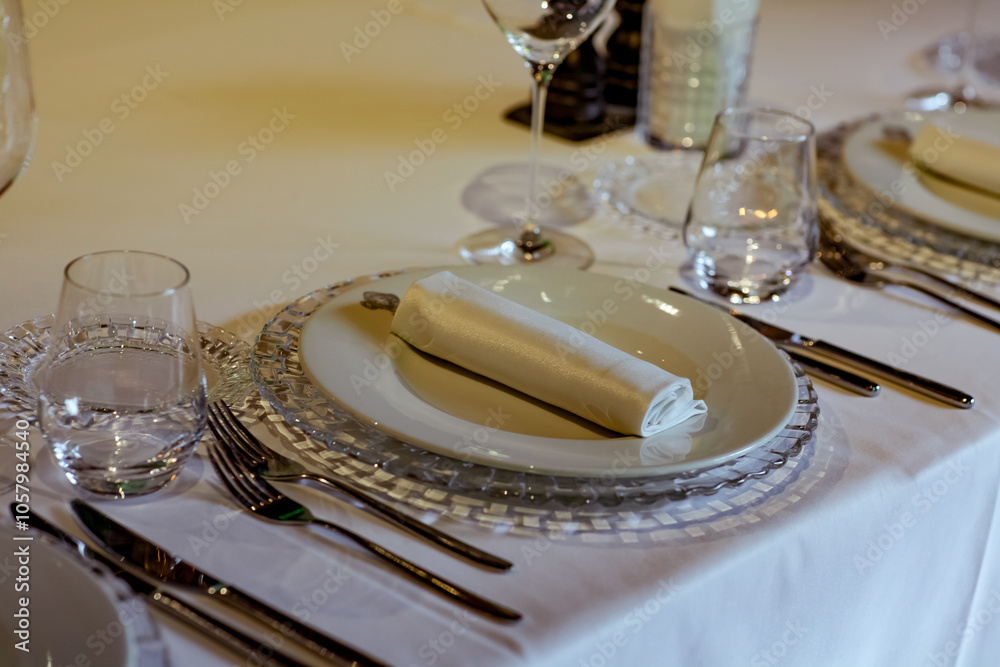 Beautiful table setting, for a holiday. with the dishes .flowers and candles