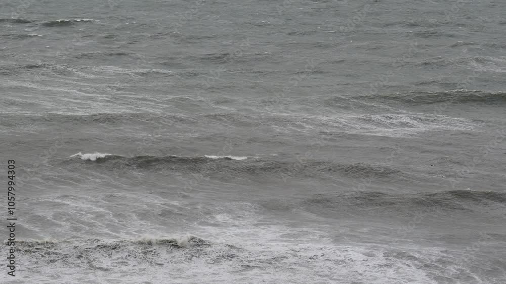 Choppy Ocean Surface During Stormy Weather Captured with Telephoto Lens in Gray Overcast Conditions Choppy Ocean Surface During Stormy Weather Captured with Telephoto Lens in Gray Overcast Conditions