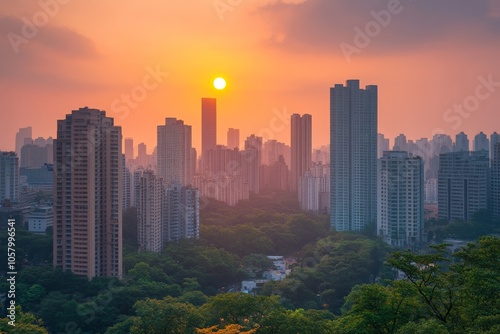 Sunset over urban cityscape with skyscrapers and trees in foreground conveying contrast between nature and metropolitan architecture in evening light