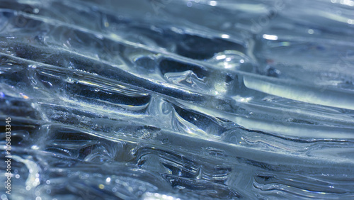 Glacial Ice Surface with Stunning Blue Tones and Complex Natural Formations photo