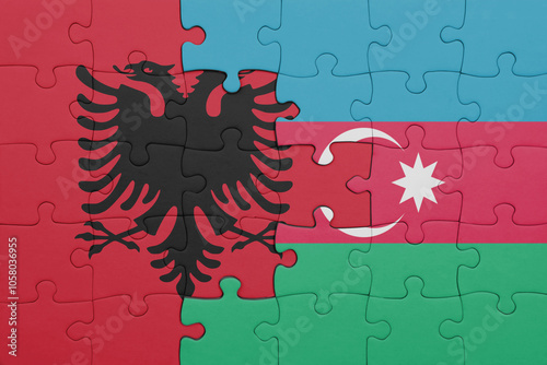 puzzle with the colourful national flag of albania and flag of azerbaijan . photo