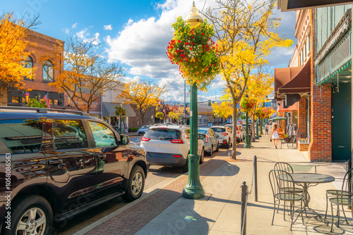 Shops and sidewalk cafes on Sherman Avenue in the lakeside small town of Coeur d'Alene, Idaho at autumn in the North Idaho panhandle region. photo