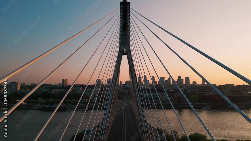 modern metal cable bridge over Vistula river at sunset, contemporary geometric architecture, cable-stayed bridge at city skyline, symmetry and architectural urban contrast, Warsaw 4k