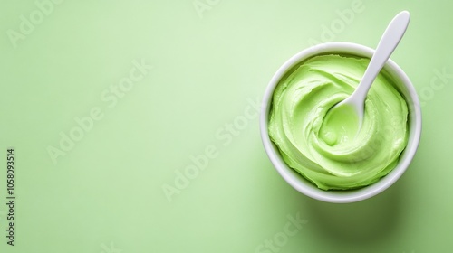 Wallpaper Mural Fresh Green Cream in a White Bowl on Pastel Background Torontodigital.ca