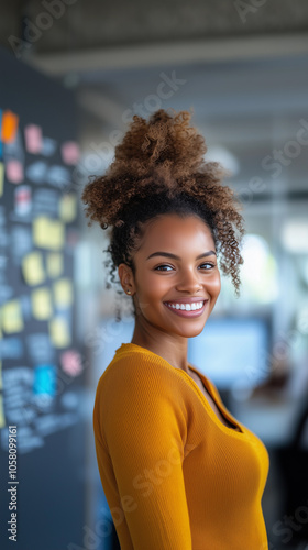 a portrait of a happy brunette woman in a coworking office with a modern branding background