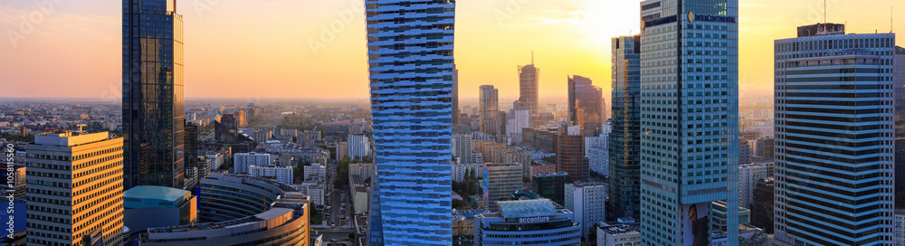 Cityscape at sunset, panorama, banner - top view of the Downtown district of Warsaw with high-rise buildings, located within the Wola district in western Warsaw, Poland