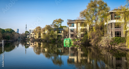 Peaceful Lakefront View with Lush Greenery and Architecture