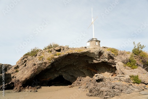 Cave Rock (Tuawera) at Sumner Beach: Iconic New Zealand Coastal Landmark photo