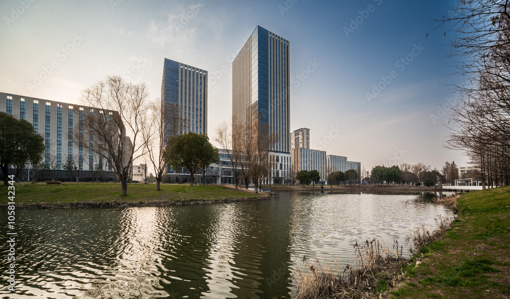 Modern Skyscrapers Reflecting in Tranquil Lake Modern Skyscrapers Reflecting in Tranquil Lake