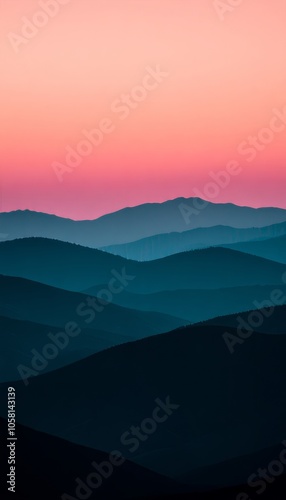 Serene landscape of rolling hills under a colorful twilight sky.