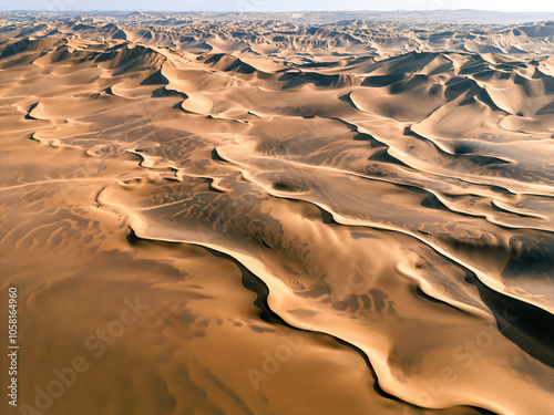 Drone background shot of the beautiful desert landscape, dusk sunlight shone on the sand dunes