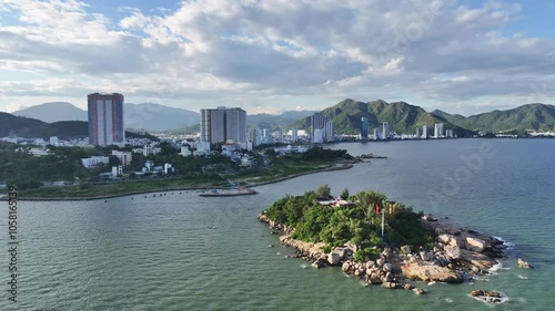 The coastal city of Nha Trang seen from above in the affternoon, beautiful coastline. This is a city that attracts to relax in central Vietnam photo