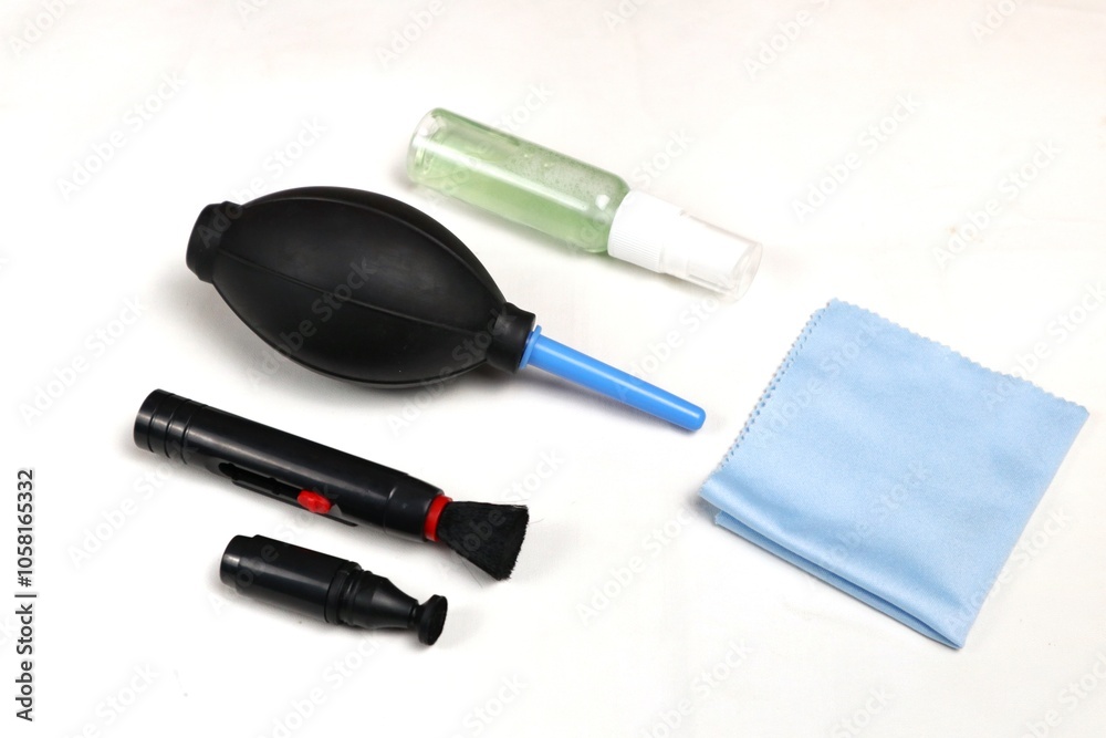 a set of camera lens cleaning tools isolated on white