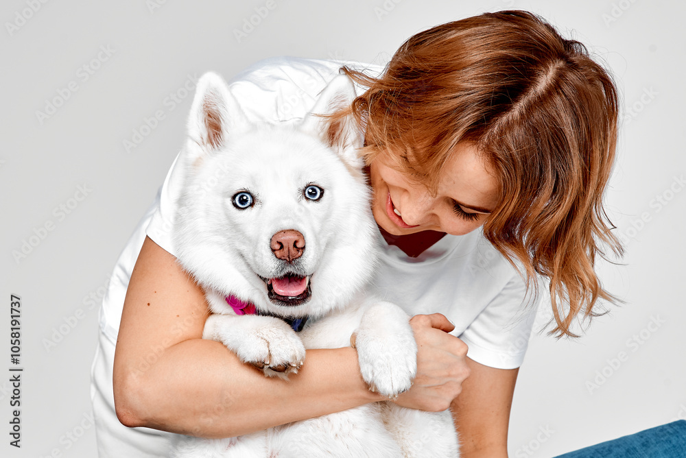 Smiling Woman Hugging Her Happy White Husky Smiling Woman Hugging Her Happy White Husky