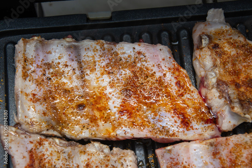 Grilling  steaks on barbecue  in Romania ,