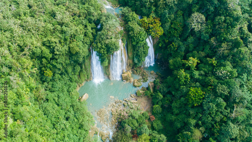 Aerial view jungle waterfall cascade in tropical rainforest at Cikaso Waterfall, Sukabumi, West Java, Indonesia Aerial view jungle waterfall cascade in tropical rainforest at Cikaso Waterfall, Sukabumi, West Java, Indonesia