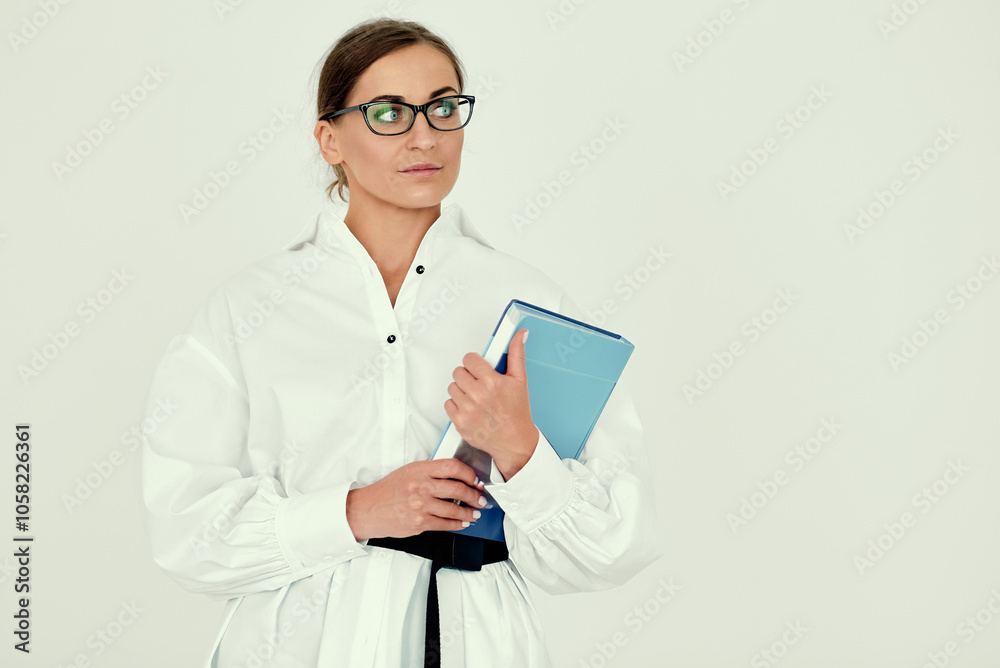 Professional Woman in Glasses Holding a Book Professional Woman in Glasses Holding a Book