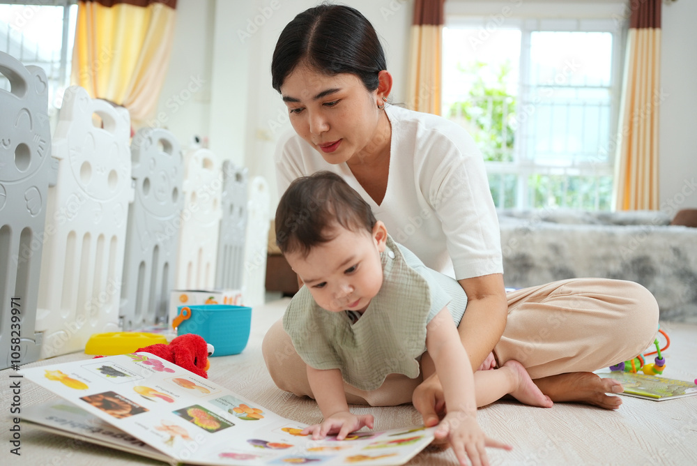Cute Asian woman and little son playing educational toys together in living room. Mom and son play cubes and laugh Happy family. Young mother and son doing activities together at home. Cute Asian woman and little son playing educational toys together in living room. Mom and son play cubes and laugh Happy family. Young mother and son doing activities together at home.