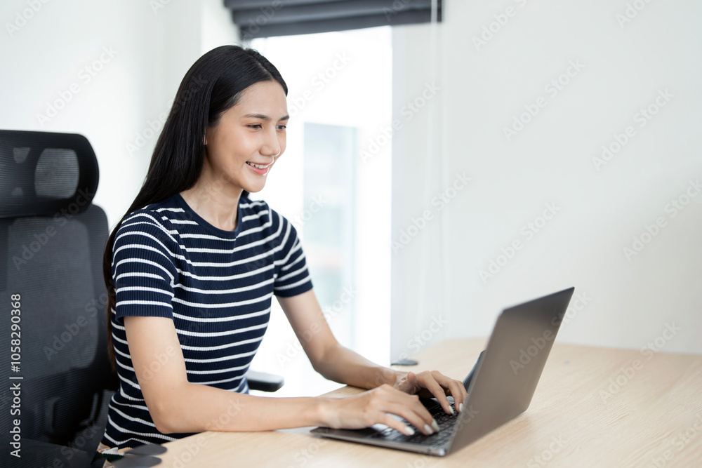 Young caucasian woman sitting alone on cozy sofa working on laptop. Freelancer in calm and cozy living room coding. Remote working in comfortable environment. Business concept Young caucasian woman sitting alone on cozy sofa working on laptop. Freelancer in calm and cozy living room coding. Remote working in comfortable environment. Business concept