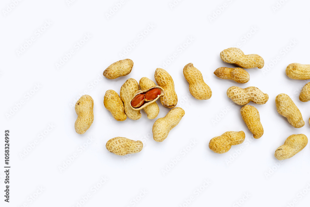 Roasted peanuts in shell on white background. Roasted peanuts in shell on white background.
