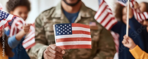 Veteran holding a small American flag, smiling as children wave flags around them in celebration